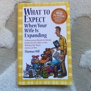 What to Expect When Your Wife Is Expanding Book by Thomas Hill - Yellow Cover